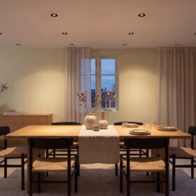 HiluX D3 Tilt360 black recessed spotlights in a dining room ceiling above an oak dining table at dusk